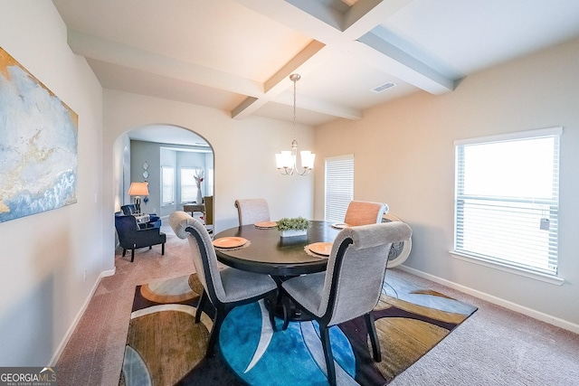 carpeted dining area featuring beamed ceiling, baseboards, a chandelier, arched walkways, and coffered ceiling