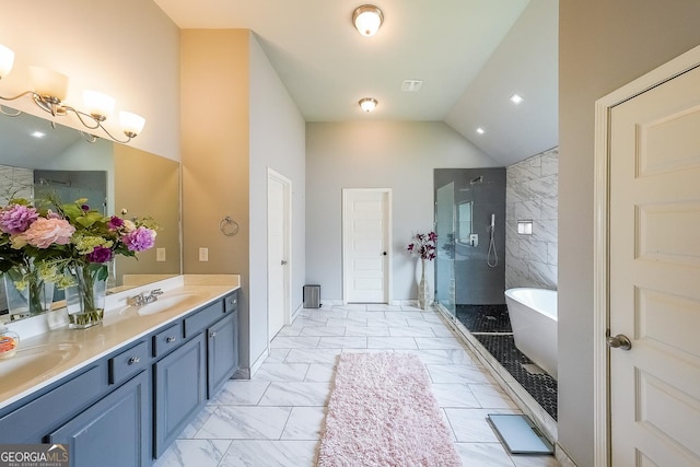 bathroom with marble look tile flooring, a stall shower, double vanity, a soaking tub, and vaulted ceiling