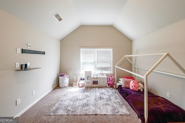 rec room with carpet and lofted ceiling