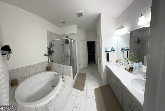 bathroom with a shower stall, a bath, double vanity, and a spacious closet