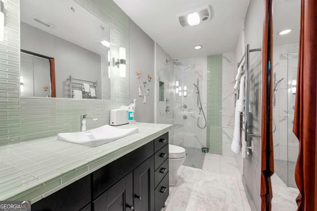 1141 Moorestown Cir, Decatur, GA 30033 - full bath with a towel warming rack, marble look tiles, vanity, a marble finish shower, and recessed lighting