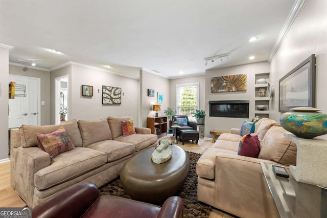 1141 Moorestown Cir, Decatur, GA 30033 - living room featuring light wood finished floors, ornamental molding, recessed lighting, and a glass covered fireplace