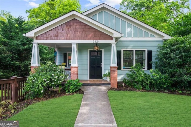 2324 Oakview Rd NE, Atlanta, GA 30317 - craftsman house featuring board and batten siding, a porch, and a front yard
