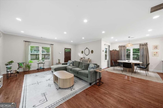 2324 Oakview Rd NE, Atlanta, GA 30317 - living area with healthy amount of natural light, wood finished floors, baseboards, recessed lighting, and ornamental molding