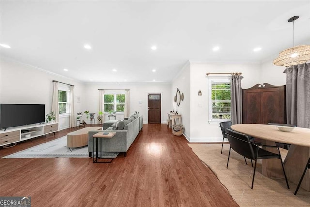 2324 Oakview Rd NE, Atlanta, GA 30317 - living area with crown molding, wood finished floors, healthy amount of natural light, baseboards, and recessed lighting