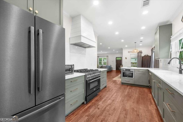 2324 Oakview Rd NE, Atlanta, GA 30317 - kitchen with freestanding refrigerator, gas stove, custom exhaust hood, a sink, and gray cabinets