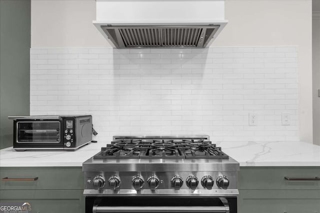 2324 Oakview Rd NE, Atlanta, GA 30317 - kitchen with extractor fan, stove, tasteful backsplash, and light stone counters