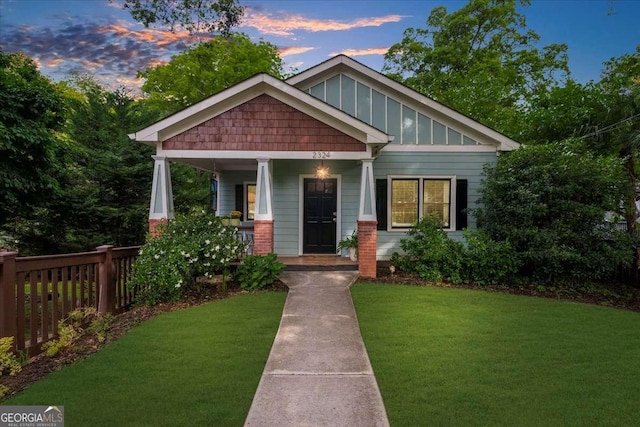 2324 Oakview Rd NE, Atlanta, GA 30317 - craftsman-style house featuring covered porch, a yard, and board and batten siding