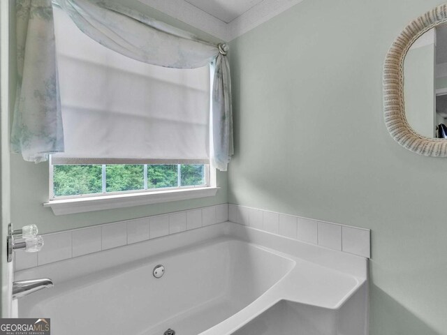 bathroom with a garden tub