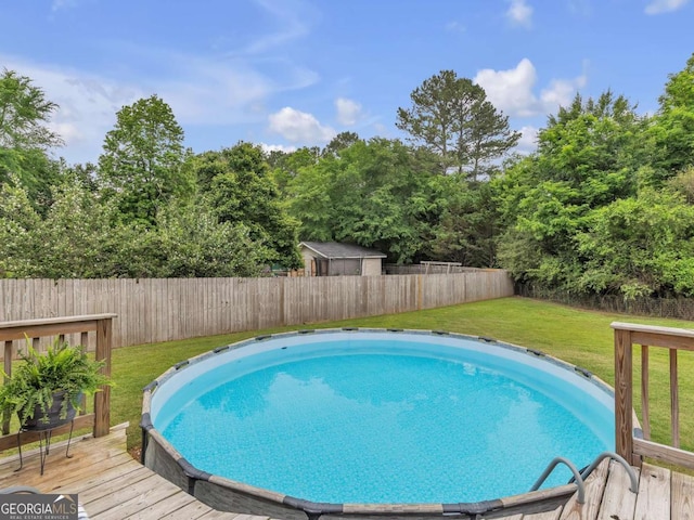 view of pool with a wooden deck