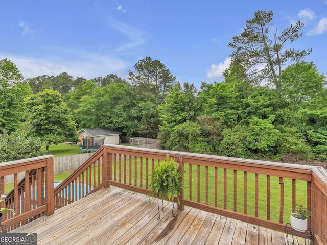 wooden deck with an outbuilding
