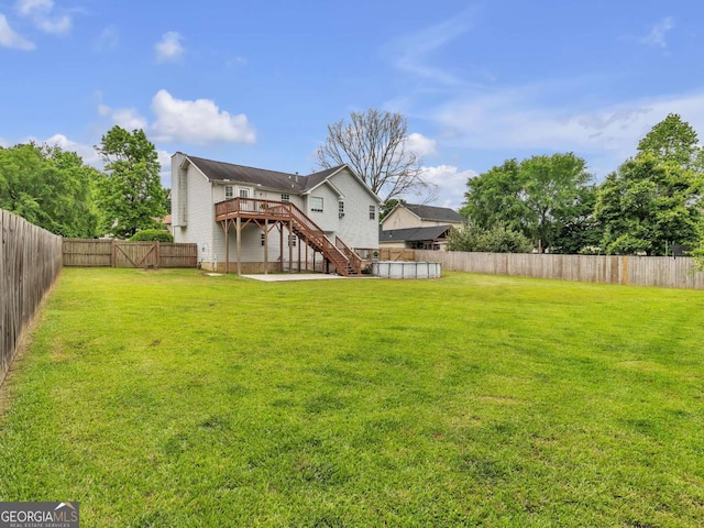 view of yard with stairway and a wooden deck