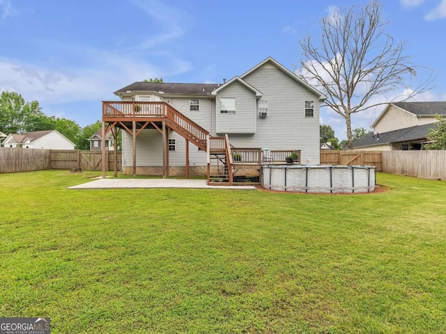 back of property featuring a deck, stairs, and a patio area