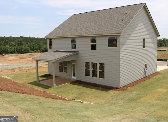 809 Brittany, Nicole Bonaire, GA 31005 - back of house with a patio, a shingled roof, and a lawn