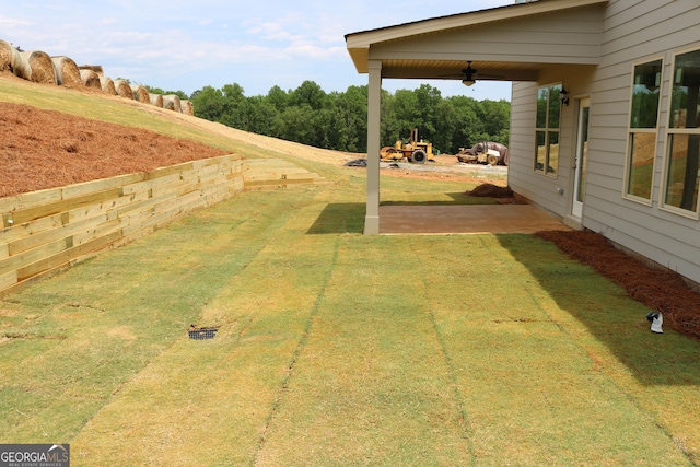 809 Brittany, Nicole Bonaire, GA 31005 - view of grassy yard featuring ceiling fan and a patio