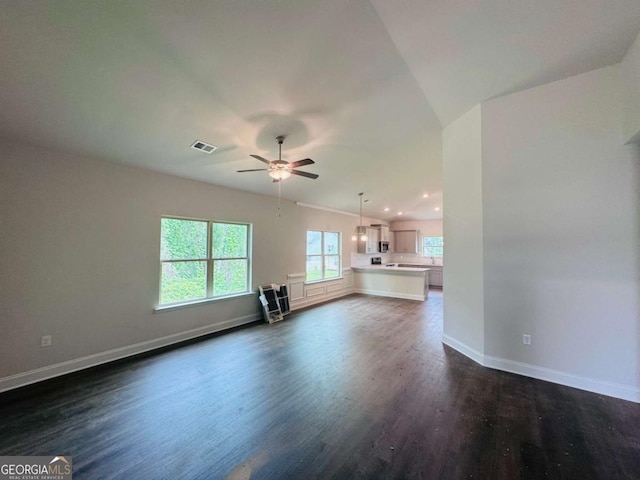 unfurnished living room featuring dark wood-style flooring, ceiling fan, baseboards, and recessed lighting