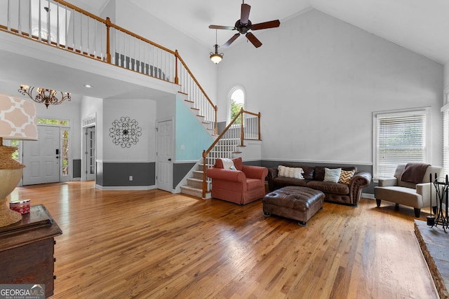 1377 Downington Ln NW, Acworth, GA 30101 - living room with high vaulted ceiling, stairway, plenty of natural light, hardwood / wood-style flooring, and a ceiling fan
