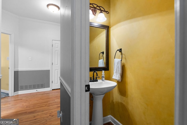 1377 Downington Ln NW, Acworth, GA 30101 - bathroom with crown molding, wood finished floors, and baseboards