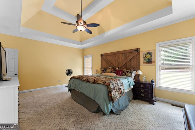 1377 Downington Ln NW, Acworth, GA 30101 - bedroom with a raised ceiling, baseboards, light carpet, and a ceiling fan