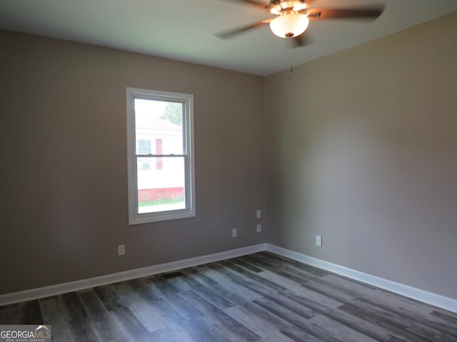 2 4th St, Cedartown, GA 30125 - empty room featuring a ceiling fan, dark wood finished floors, and baseboards