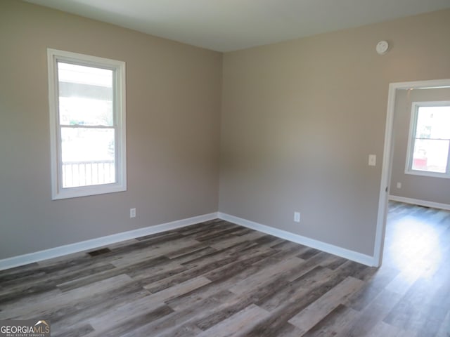 2 4th St, Cedartown, GA 30125 - spare room featuring dark wood finished floors, baseboards, and a smoke detector