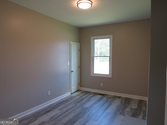 2 4th St, Cedartown, GA 30125 - spare room with baseboards and dark wood finished floors