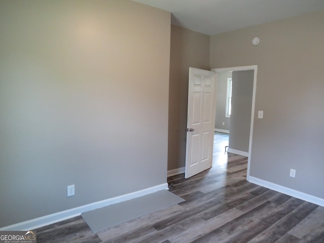 2 4th St, Cedartown, GA 30125 - spare room with dark wood-style flooring and baseboards