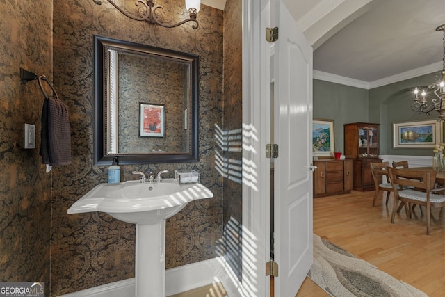4298 Kingston Gate Cv, Chamblee, GA 30341 - bathroom with a chandelier, wood finished floors, and crown molding