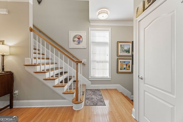 4298 Kingston Gate Cv, Chamblee, GA 30341 - stairway with wood finished floors, plenty of natural light, baseboards, and ornamental molding