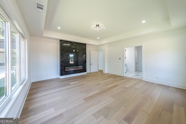 972 Auburn Rd, Dacula, GA 30019 - unfurnished living room featuring a raised ceiling, light wood finished floors, recessed lighting, and baseboards