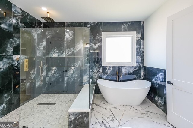 972 Auburn Rd, Dacula, GA 30019 - bathroom featuring a freestanding tub, a marble finish shower, tile walls, and marble tiled floors