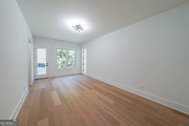 972 Auburn Rd, Dacula, GA 30019 - spare room with light wood-style floors and baseboards