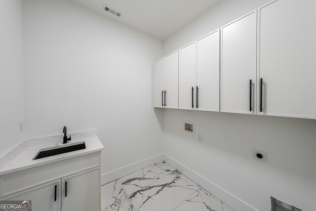 972 Auburn Rd, Dacula, GA 30019 - washroom featuring hookup for an electric dryer, cabinet space, light marble finish flooring, baseboards, and washer hookup