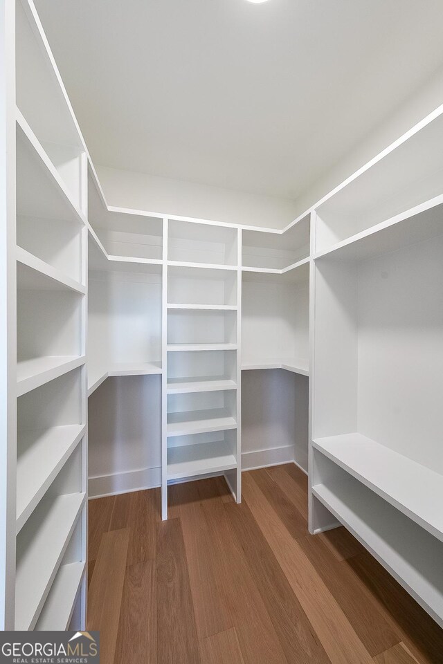 972 Auburn Rd, Dacula, GA 30019 - walk in closet featuring dark wood finished floors