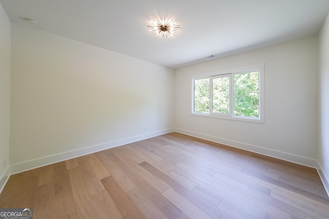 972 Auburn Rd, Dacula, GA 30019 - empty room with light wood-type flooring, baseboards, and a smoke detector
