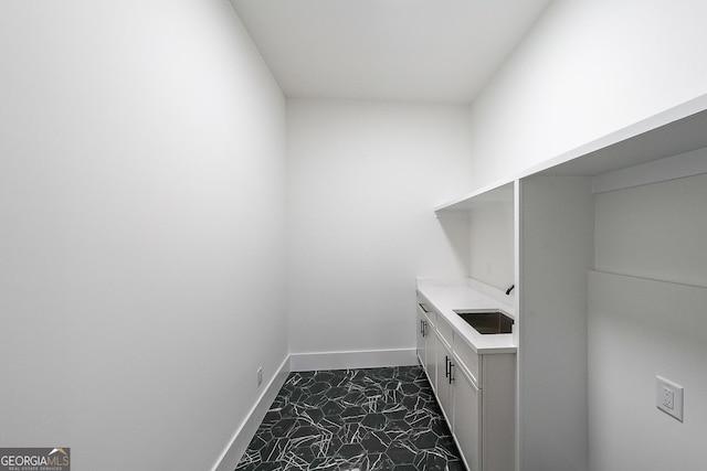 972 Auburn Rd, Dacula, GA 30019 - washroom with a sink and baseboards