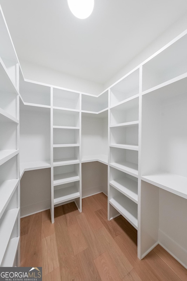 972 Auburn Rd, Dacula, GA 30019 - spacious closet featuring wood finished floors