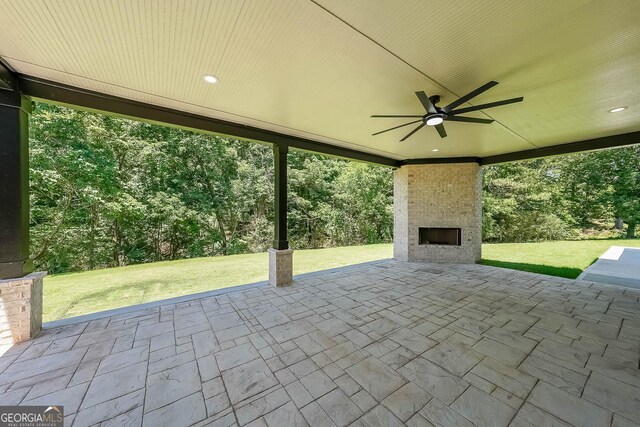 972 Auburn Rd, Dacula, GA 30019 - view of patio / terrace with a fireplace and a ceiling fan