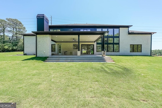 972 Auburn Rd, Dacula, GA 30019 - back of property featuring a lawn, a chimney, ceiling fan, and a patio