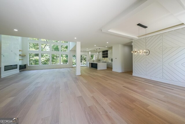 972 Auburn Rd, Dacula, GA 30019 - unfurnished living room with a fireplace, light wood finished floors, and recessed lighting