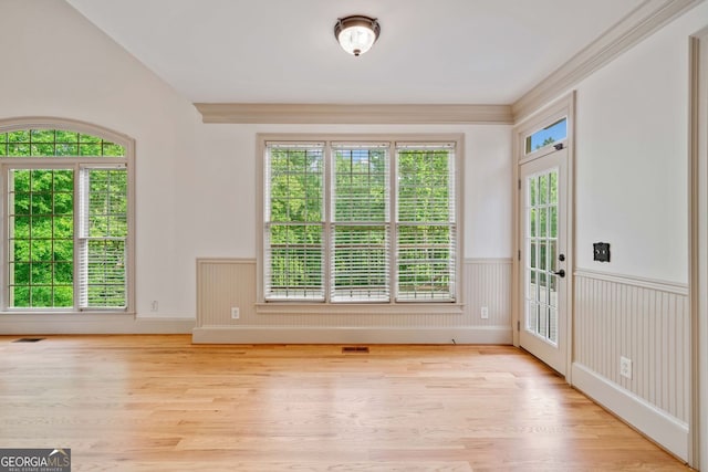 entryway with wainscoting and wood finished floors