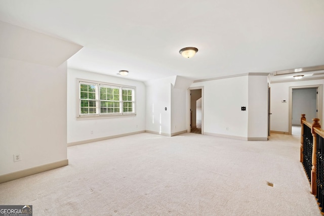 empty room with carpet flooring and baseboards