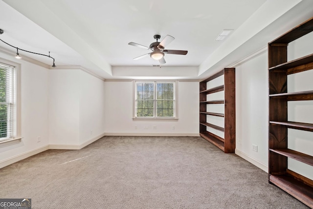 300 Hemlock Cv, Ball Ground, GA 30107 - carpeted empty room featuring ceiling fan, baseboards, and a tray ceiling