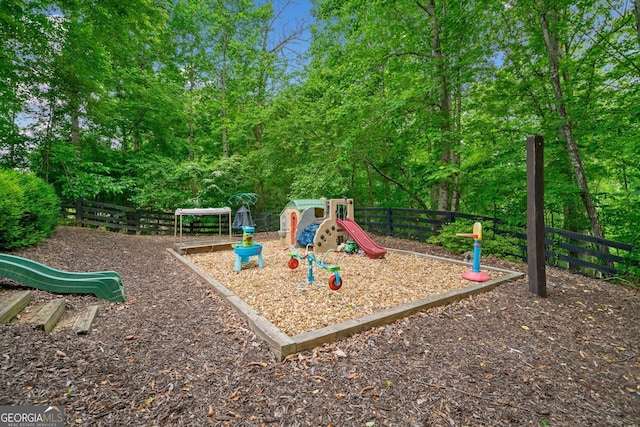 community jungle gym featuring fence