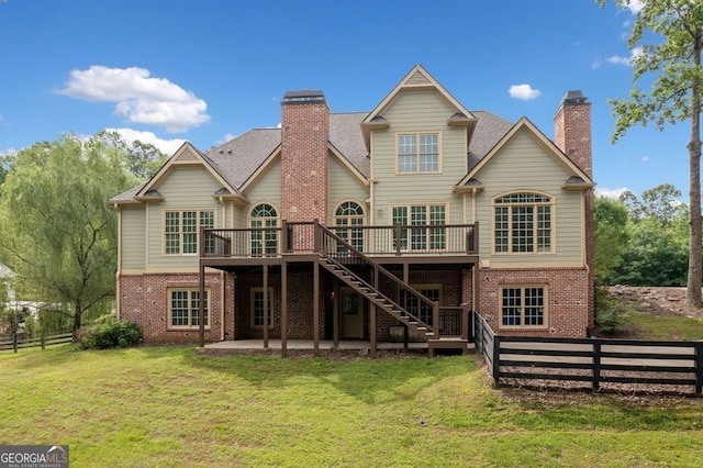 300 Hemlock Cv, Ball Ground, GA 30107 - back of house featuring brick siding, a deck, and a chimney