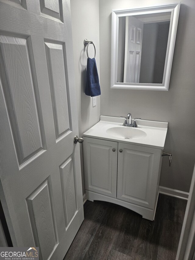414 E 17th St SW, Rome, GA 30161 - bathroom featuring vanity, wood finished floors, and baseboards