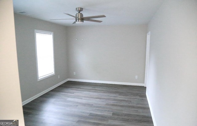 414 E 17th St SW, Rome, GA 30161 - spare room featuring ceiling fan, dark wood-style flooring, and baseboards