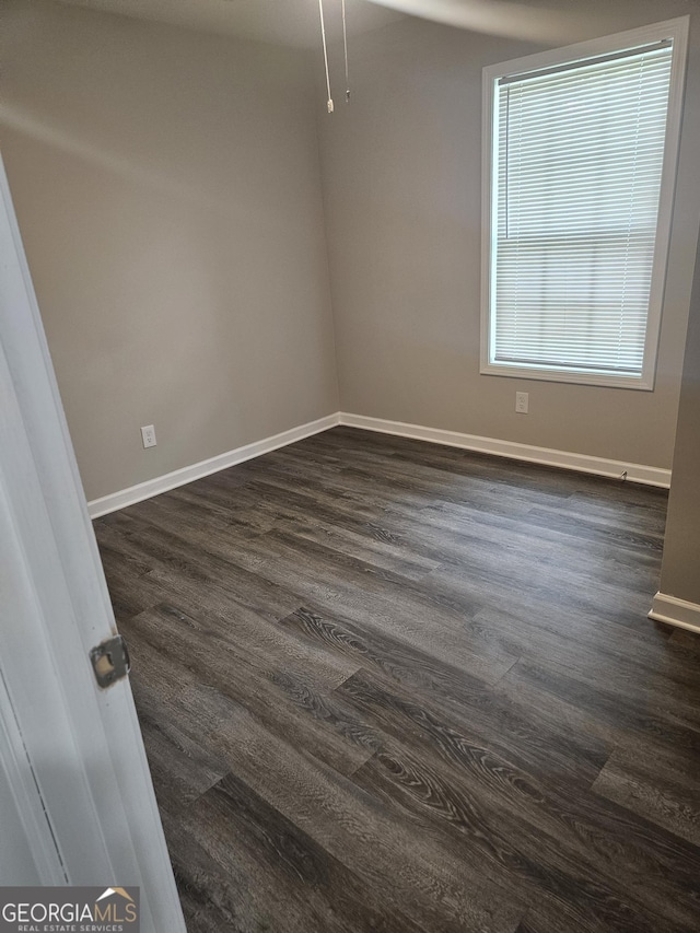 414 E 17th St SW, Rome, GA 30161 - spare room with baseboards and dark wood-type flooring
