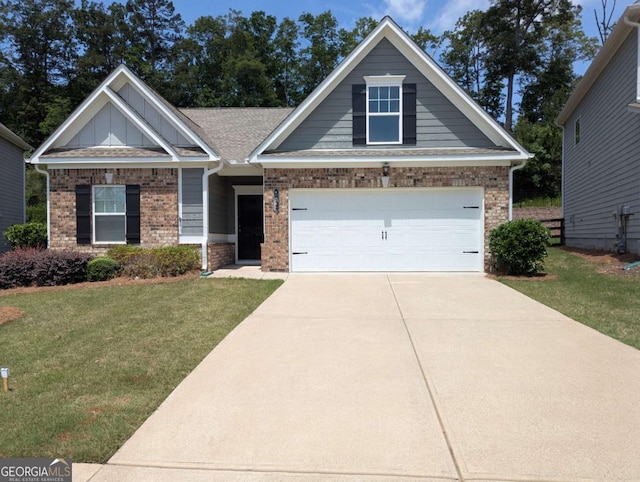 131 Prominence Ct, Canton, GA 30114 - craftsman-style home with brick siding, a front yard, concrete driveway, and a garage