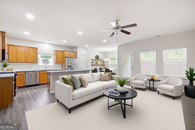 131 Prominence Ct, Canton, GA 30114 - living room with wood finished floors, a ceiling fan, and recessed lighting